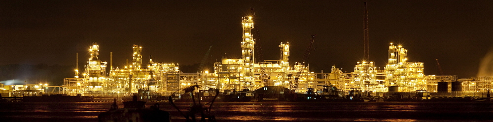 Niger Delta: Chevron LPG installations lit up at night. Oil pollution in the Delta is causing tremendous problems for the local community. Petterik Wiggers / Panos