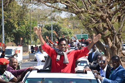 Hakainde Hichilema waves to the crowd on his release from prison in August. (Xinhua/David Kashiki)