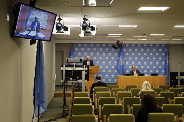 9 December 2020: António Guterres (1st right, rear) and Moussa Faki Mahamat (on screen) attend joint press conference at UN HQ, New York. Pic: Xie E/Xinhua News Agency/PA Images